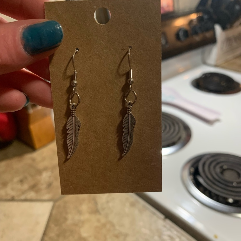 Feather earrings for 6$ more like this in my store